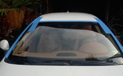 Why do you have to leave tape on new windshield?